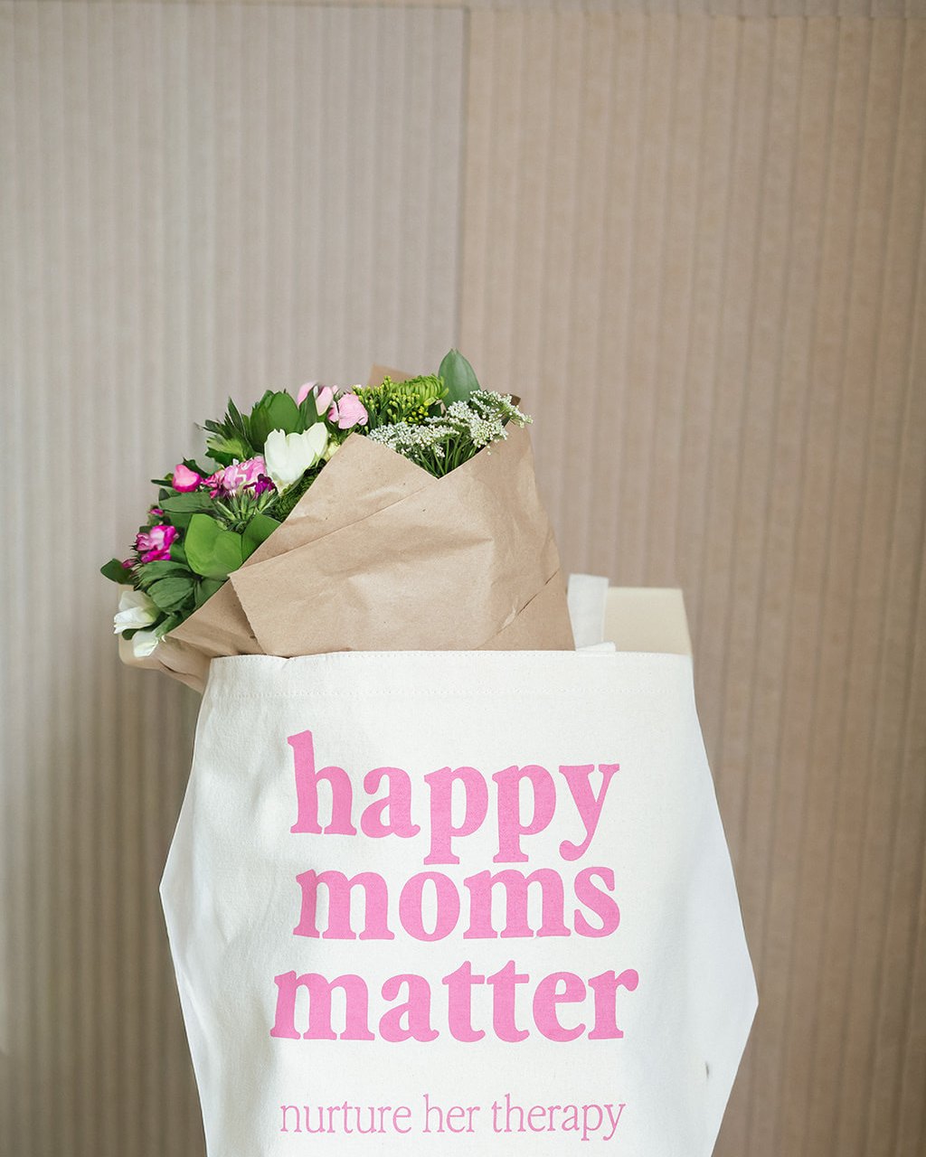 A happy moms matter tote with flowers — more to come